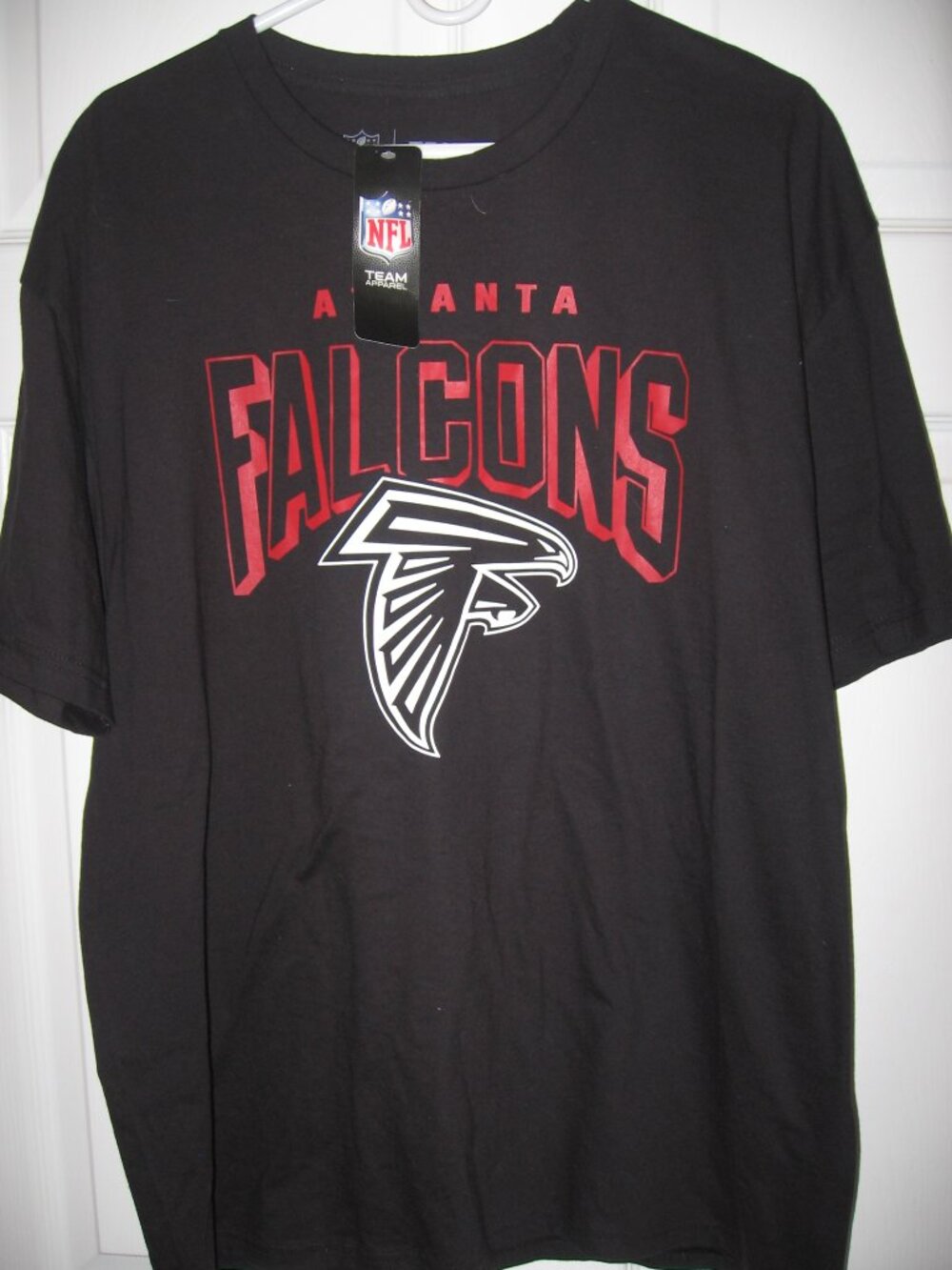 You are considering an NFL Team Apparel Atlanta Falcons t-shirt. Men's size XL.